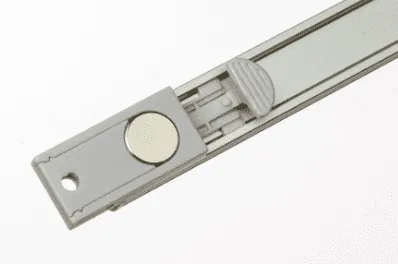 Metal slider with a magnetic button.