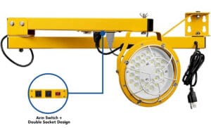 Yellow industrial LED work light with sockets.