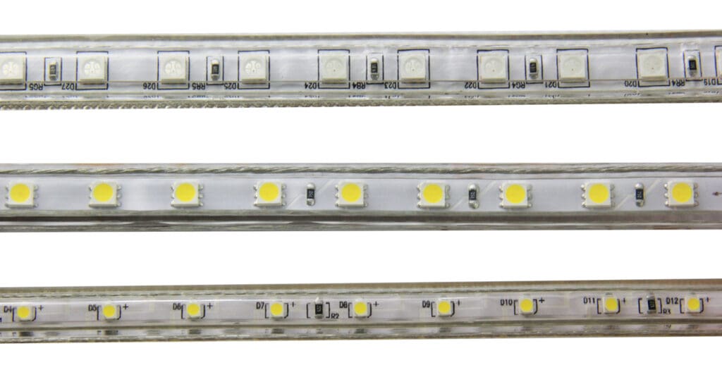LED strip with white lights on white background.
