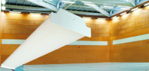 Indoor sports hall with overhead lighting structure.